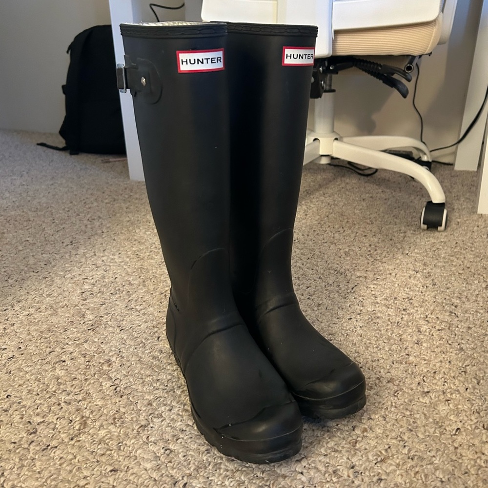 Black tall hunter boots